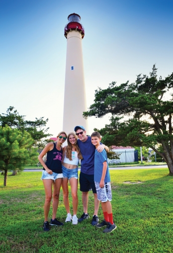 Famil posing for a picture at the Cape May Lighthouse